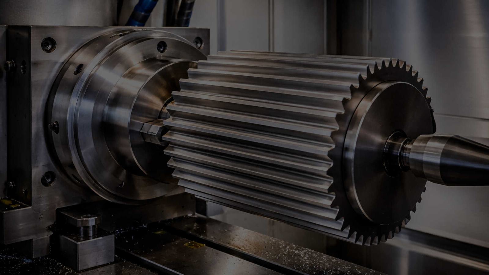 CNC machining centre cutting a precision gear component at Aumic Engineering
